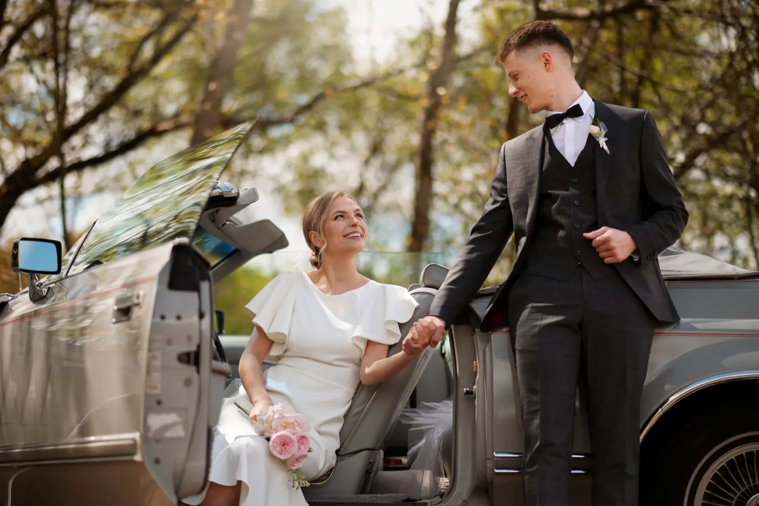 just-married-couple-with-their-car